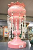 An attractive 19th century pink glass mantel lustre having cut glass spears, gilt edging and painted