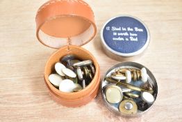 A small assortment of cufflinks, including engraved examples and mother-of-pearl pieces