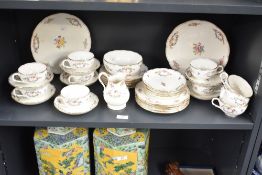 A Mintons fine bone china tea service, having gilt edge and floral patterns, to include plates, cups