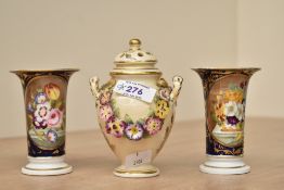 A Royal Crown Derby bone china urn with cover, having shaped handle and floral relief decoration,