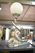 An attractive modern figural table lamp of Art Deco design, formed as an outstretched partially nude