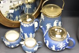 A selection of Wedgwood blue Jasper wares, comprising teapot, milk jug, biscuit barrel, sugar and