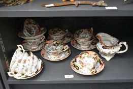 A group of Masons type ironstone Imari pattern teawares, ten tea cups and seven saucers and milk