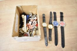 A collection of costume jewellery, including wristwatches, brooches and an Elizabeth II six pence in