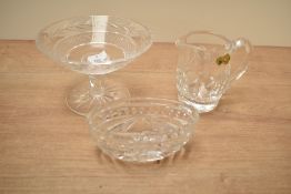 A Waterford cut crystal cream jug, h10cm, sold alongside a dish ect, (3)