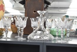A Cumbrian crystal decanter with stopper, h21cm, sold together with 8 glasses