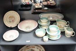 A Susie Cooper 'Burslem' dinner service, decorated with floral patterns, to include ashet, cream jug