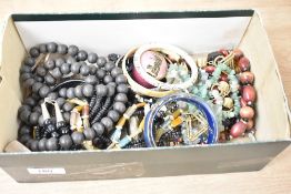 An assortment of costume jewellery, including fluorite and amethyst chip necklaces, bangles and