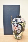 A Moorcroft pottery vase of lobed form having tube line decoration, painted makers marks to base,