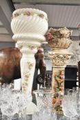 A ceramic capodimonte jardinière and stand having Corinthian column and floral decoration, h64cm,