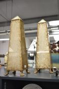 A pair of 20th century obelisks raised on paw feet, h47