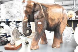 A large carved wooden study of an elephant, height approx. 55cm