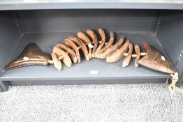 A wood and metal fish skeleton sculpture, L81cm