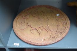 A circular Chinese style wall hanging plaque depicting a traveller returning home from his journey