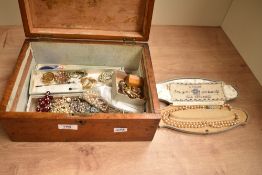 A 20th century wooden box, of hinged rectangular form having shield inlays, containing an assortment