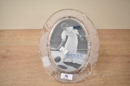 A waterford crystal picture frame of oval form decorated with floral patterns, h25cm