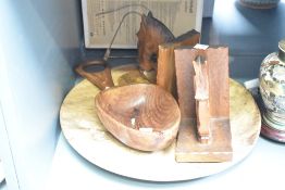 A pair of wooden bookends in the form of a horses head, h17cm, sold together with a wooden bowl