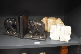 A pair of wooden elephant bookends, h16cm, sold together with two elephant stone book ends ect, (6)