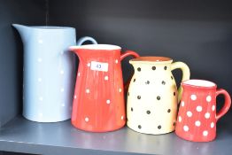 A Gisela Graham pitcher having white dots on a blue ground, h20cm, sold together with 3 other