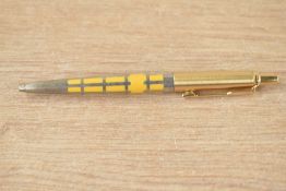 A Parker Jotter 50th Anniversary edition ballpoint pen in saffron yellow with silver filigree and