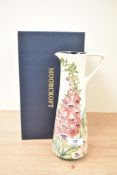 A Moorcroft pottery pitcher having tube lined floral decoration, signed to base Rachel Bishop, dated