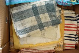 (Lot 62) Assorted woven and needlework home linens to include a set of terracotta tablecloths and