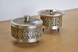 Two vintage music-box powder-puff vanities, a Lady-Mate with concentric diamond design, makes a tune