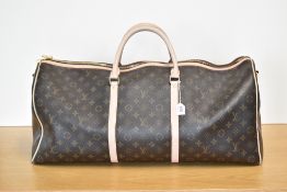A vintage Louis Vuitton monogrammed hold-all in brown leather with beige smooth leather trims,