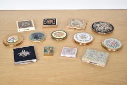 Twelve vintage compacts featuring handmade Petit-Point and intricate floral cross stitch embroidery,