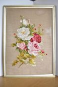 An early 20th century framed hand embroidery, depicting a bouquet of roses in red, pink, white and