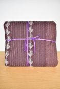 A rare early 1800s quilt, burgundy and white paisley pinstripe cotton, with brown wool reverse
