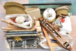 A quantity of 20th century weaving and spinning equipment, including Baron & Hogarth loom shuttle