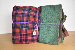 A vintage wool patchwork quilt arranged in a brickwork design on both sides, showcasing tweeds,