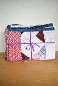 An antique patchwork quilt in soft cotton, with local interest featuring the Cumbrian regional