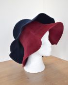 Two vintage women's Borsalino Italian hats, a navy blue and a burgundy red, wide bimmed bucket