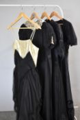 Four antique and vintage black dresses, comprising an Edwardian handmade taffeta and net dress