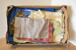 A quantity of vintage fabrics, comprising a bundle of four large fabric remnants, including: