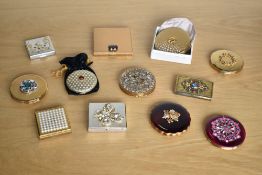 Twelve vintage compacts featuring various jewel and pearl effect embellishments, a range of shapes