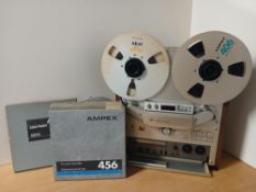 An Akai 747 Reel to Reel Tape player - 2 Channel - an eye catching vintage item that comes with some