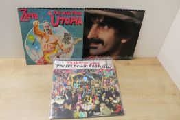 A FranK Zappa lot of three Digital Remastered albums - sleeves have storage wear at VG - vinyl is