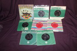 A Beatles lot of 12 singles and Ep's - comes with Magical Mystery Tour ep with booklet - VG or