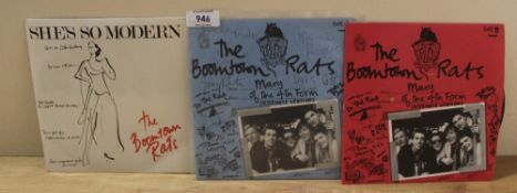 A Boomtown Rats 2 x 7' single with one being full signed by the band includes Sir Bob Geldof in he