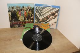 A lot of two Beatles albums with the Blue Album - 2LP and a copy of Sgt Pepper's Lonely Hearts