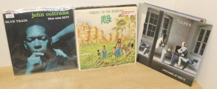 A mixed lot of twenty six records from the like of John Coltrane , Wings , Steel Pulse and more -