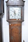 A period oak long cased clock having 30 hour movement and painted dial, named for Thos. Philips,