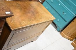 An early 20th Century walnut bedding box , having lift lid and drawer, width approx. 94cm