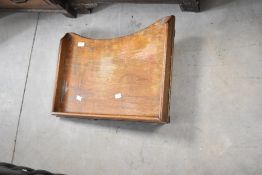A vintage bed tray having fold out legs, width approx. 56cm