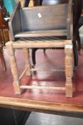 A oak framed strung stool and a book trough