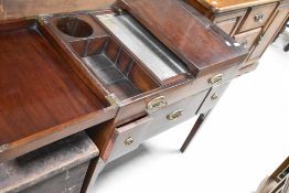 A 19th Century Regency design mahogany fold out washstand having mirror and compartmental