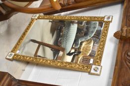 A vintage gilt wall mirror having tile decoration to corners, approx. 88 x 62cm